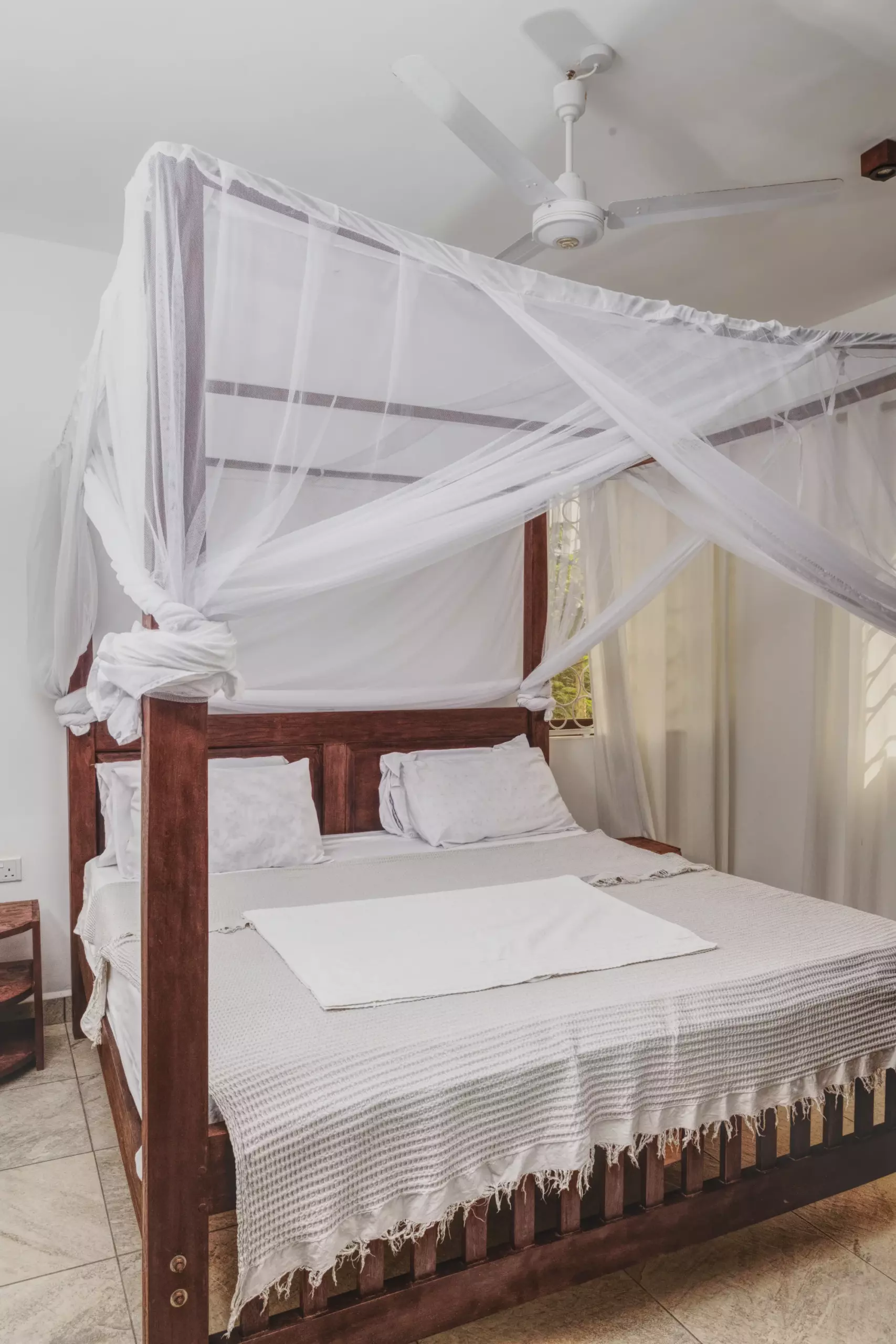 Lovely white bed at Dacha Diani Apartments